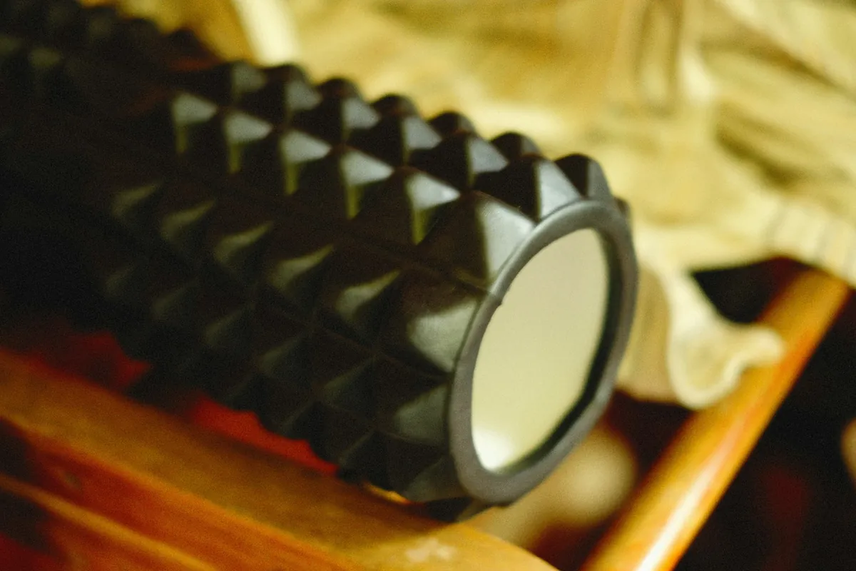Close-up of a textured foam roller in warm light
