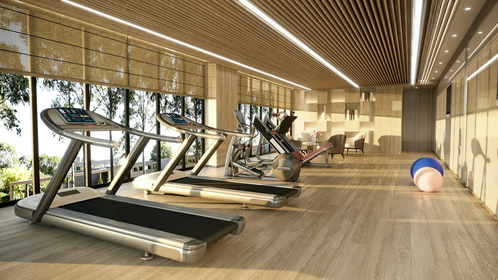 Bright lounge area with treadmills, wood floors and big windows