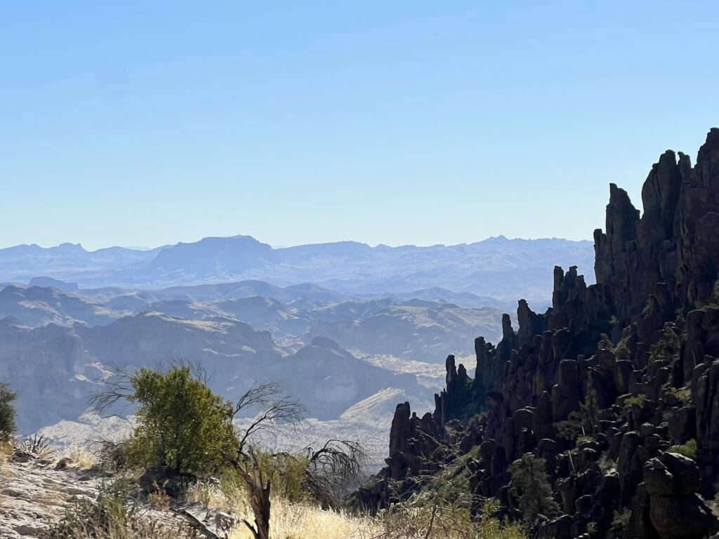 Rugged desert mountain ridges under a clear blue sky, photographed by Adam Neuerburg while hiking
