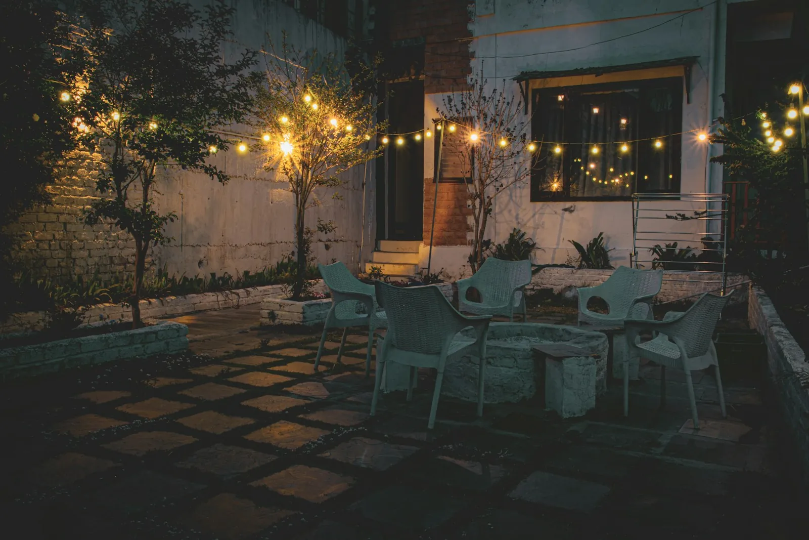 Courtyard patio with string lights at dusk