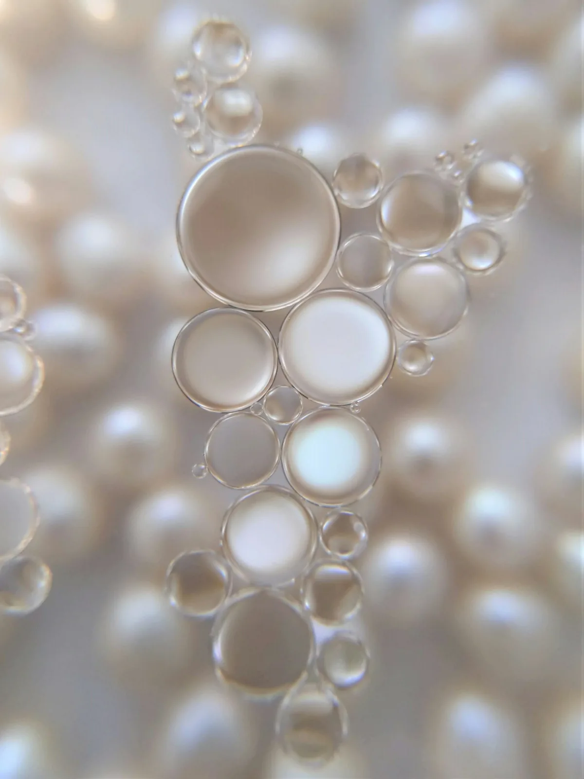 Close-up of pearls and translucent bubbles in soft light