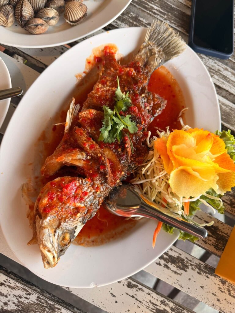 Whole fried fish in red curry sauce, a Thai dish that inspires Adam Neuerburg's cooking