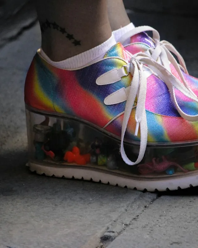 Rainbow platform sneakers with clear soles filled with tiny toys